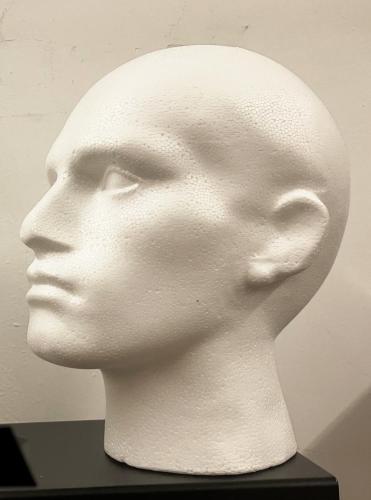 Polystyrene male head before work begins. (The nose is often damaged in transit)